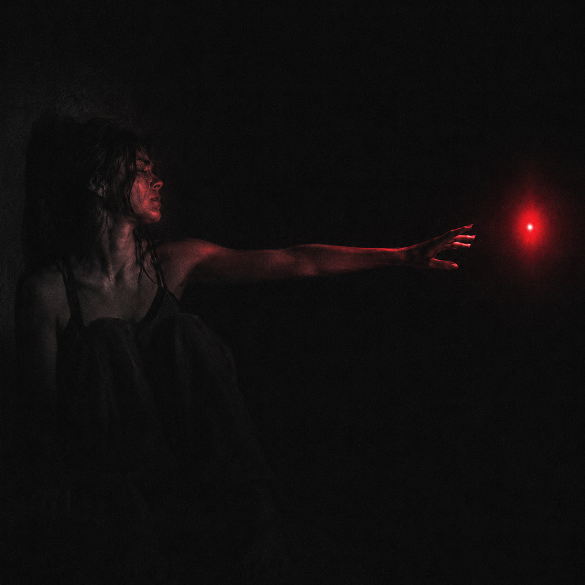 Dopamine in toxic relationships: a woman in darkness reaching toward a distant red light, her face turned away from what her hand is chasing